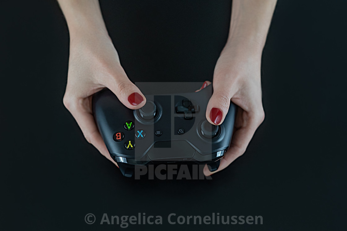 Top View Of Woman Hands With Red Nail Polish On Fingers Holding A
