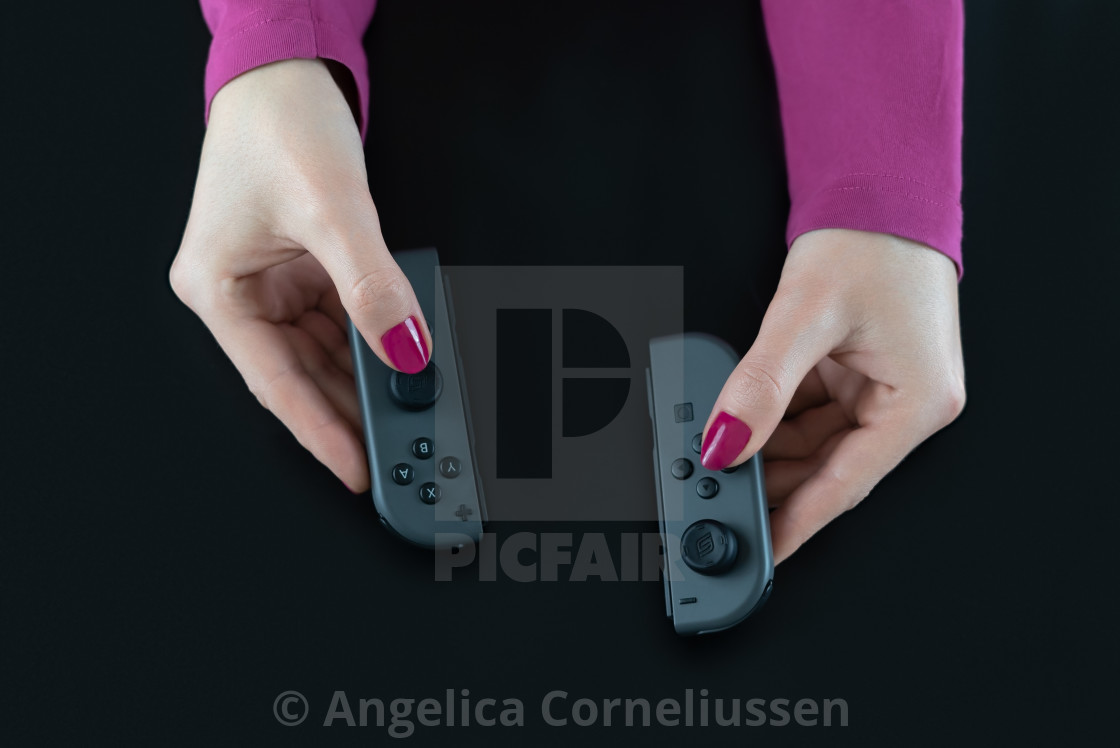 Top View Of Woman Hands With Pink Nail Polish On Fingers Holding