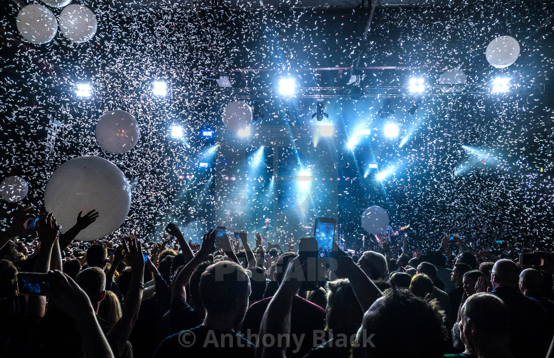 "Crowd with lights, balloons and confetti" stock image