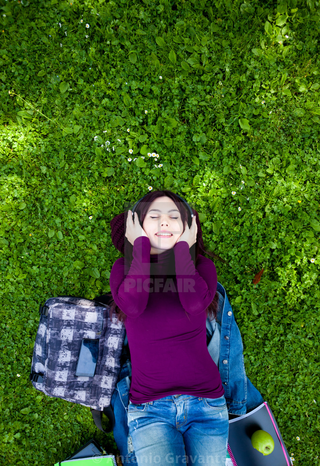 "Young Woman to Listening Music via Headphone in the Park." by Antonio Gravante - $10.72 "Young Woman to Listening Music via Headphone in the Park." stock image