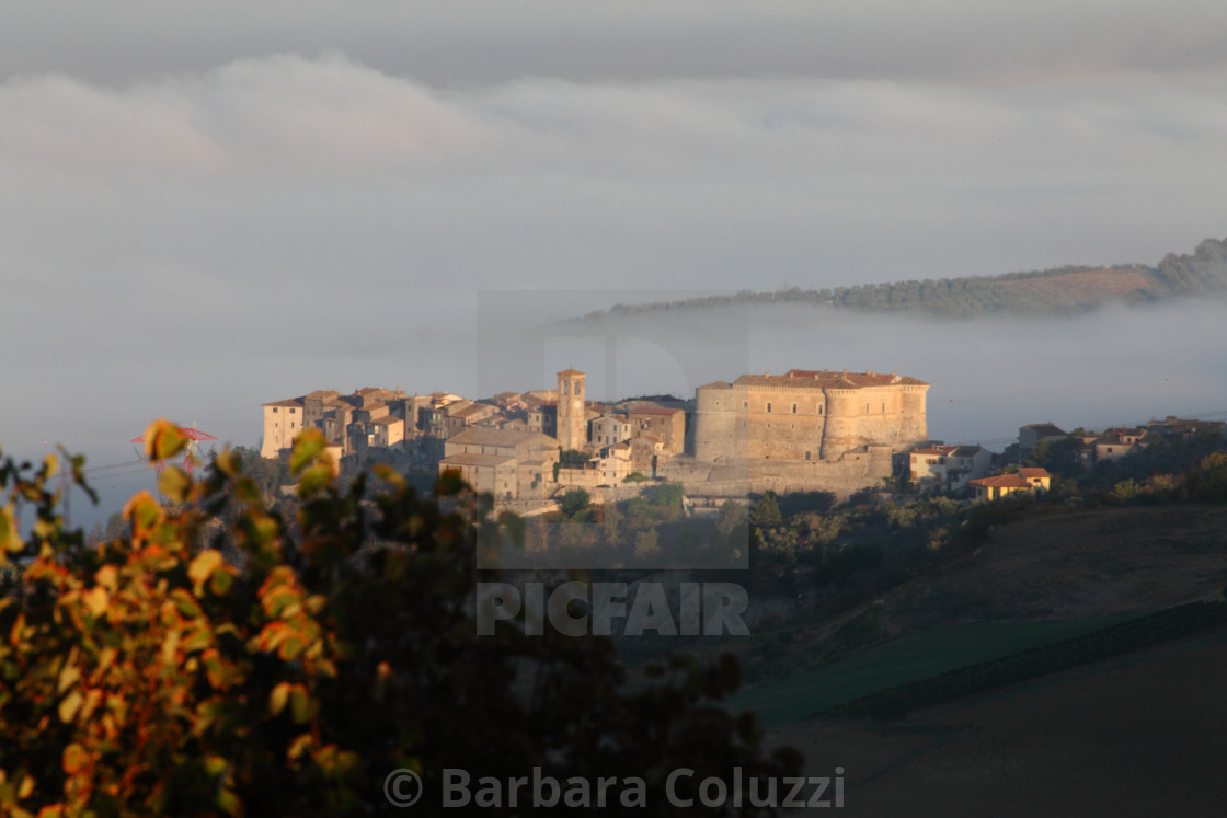 "Alviano: A view of the historical center at the sunrise, within the fog." stock image