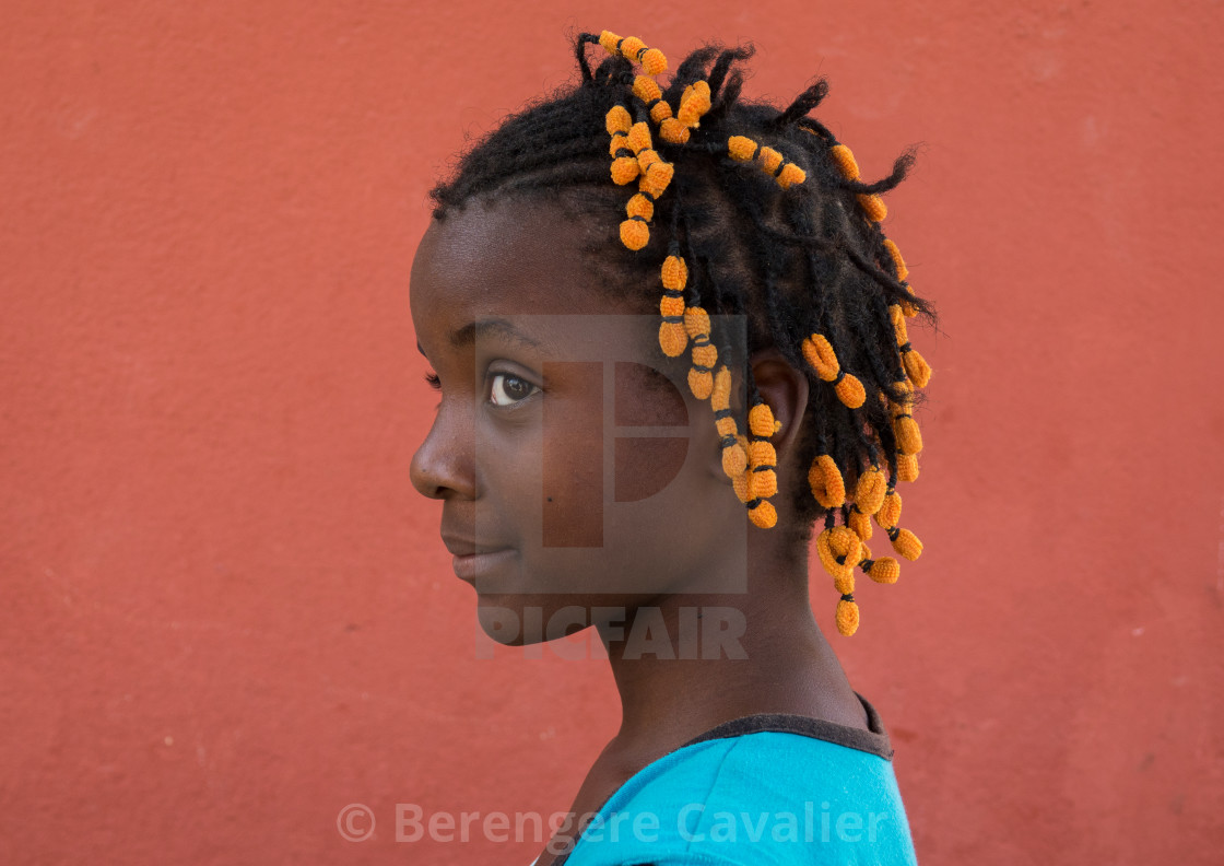 Portrait of a Angolan girl with the typical hairstyle made of braids with... - License, download or print for £ | Photos | Picfair Portrait of a Angolan girl with the typical hairstyle made of braids with... - License, download or print for £ | Photos | Picfair