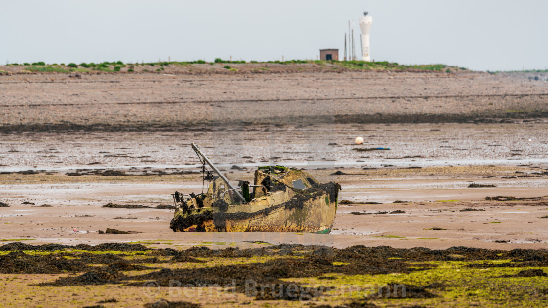 "A damaged boat in the mud, seen near Barrow-In-Furness, Cumbria," stock image