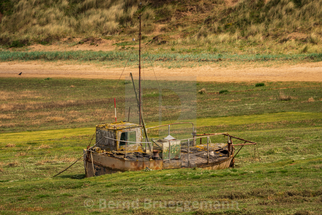 "A damaged Boat in the grass, seen in Askam-in-Furness, Cumbria," stock image