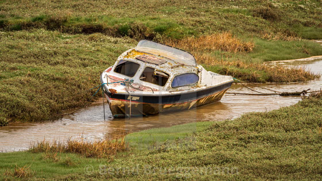 "A damaged Boat in the grass, seen in Askam-in-Furness, Cumbria," stock image