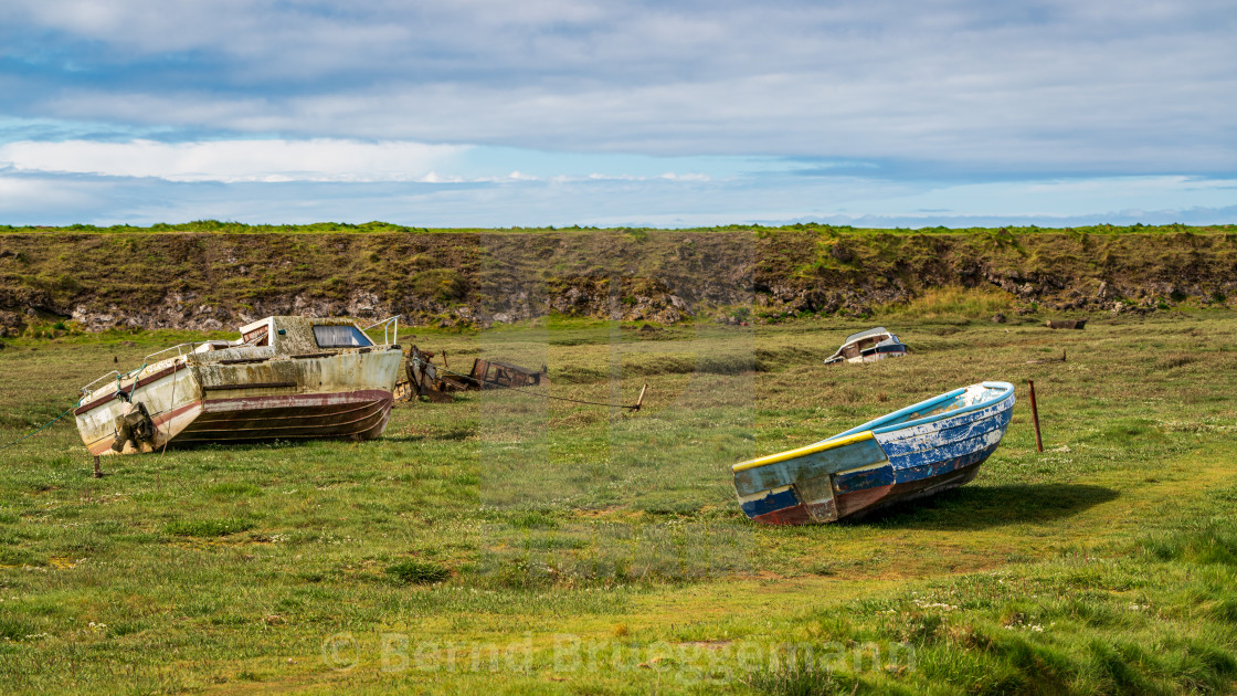 "A damaged Boat in the grass, seen in Askam-in-Furness, Cumbria," stock image