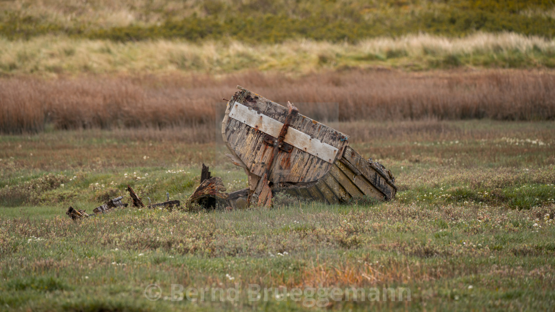 "A damaged Boat in the grass, seen in Askam-in-Furness, Cumbria," stock image