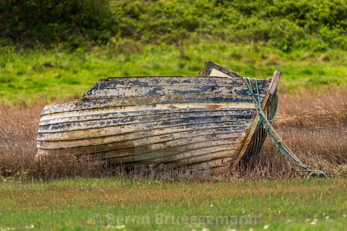 "A damaged Boat in the grass, seen in Askam-in-Furness, Cumbria," stock image