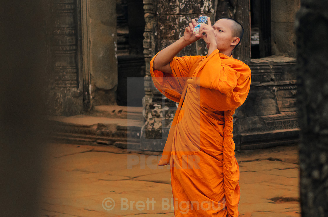 "Monk Taking a Photo" stock image