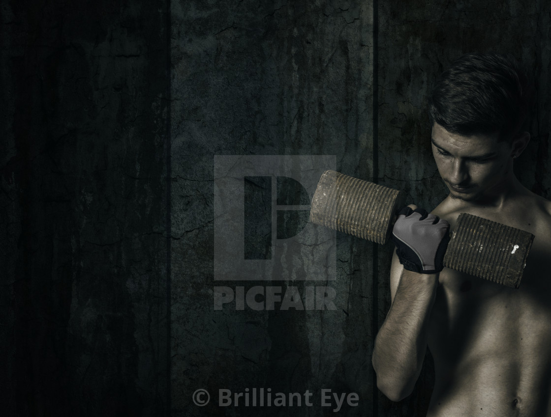 Power Athletic Young Bodybuilder Doing Exercises With Rusty Dumbbell License Download Or Print For 22 32 Photos Picfair