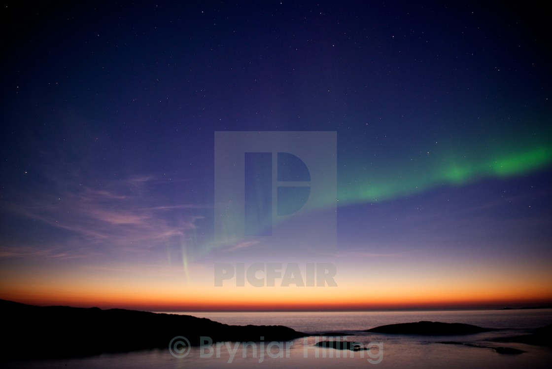 "northern Lights over sunset" stock image