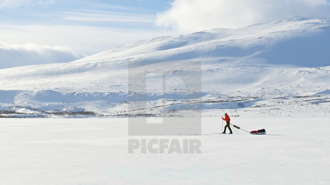 "skiing over lake" stock image