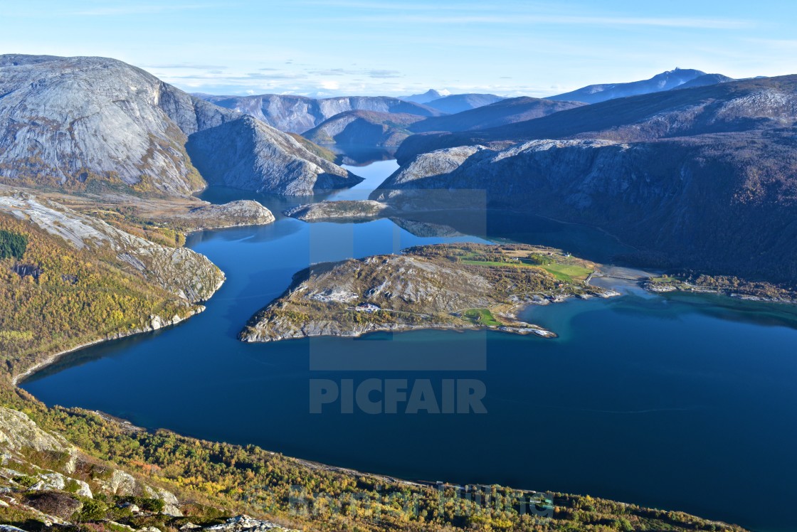 "Fjord with blue water and colorful trees" stock image