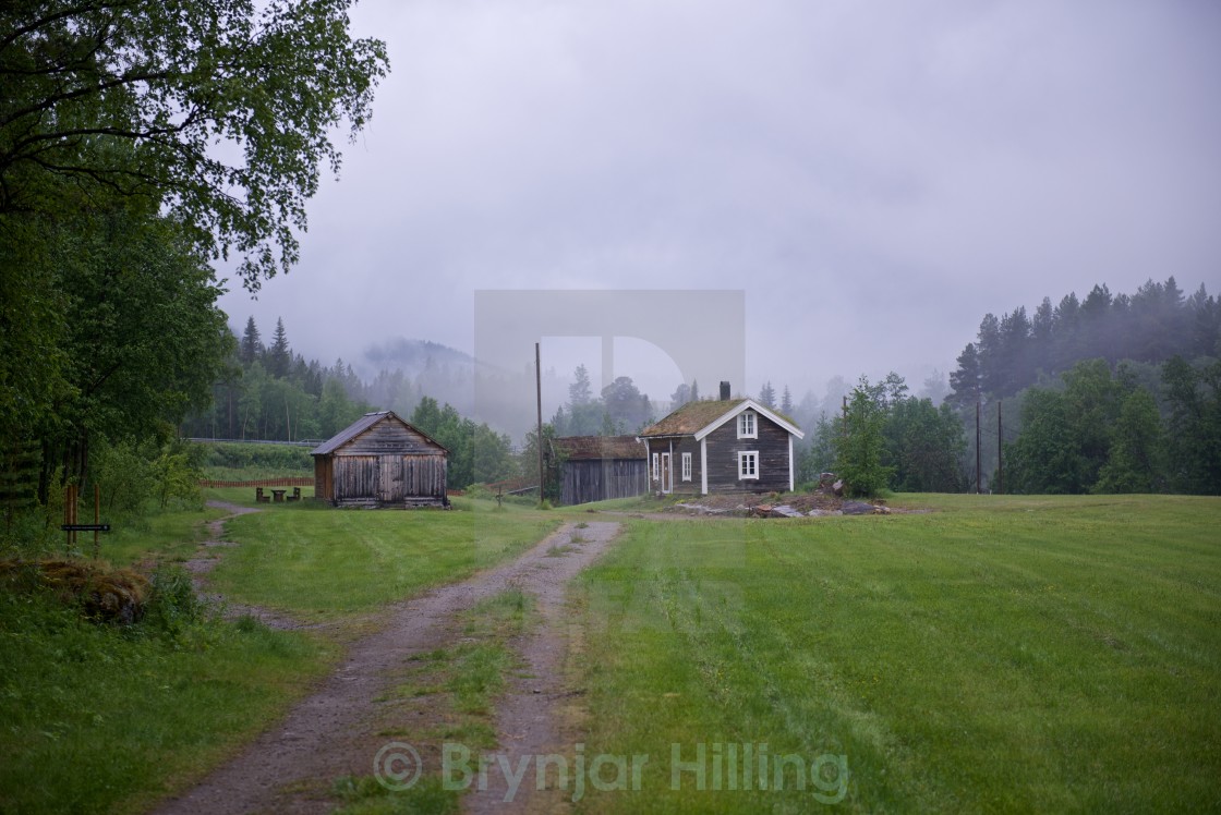 "Timber house in mist" stock image