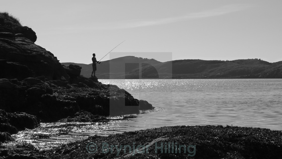 "fishing from land" stock image