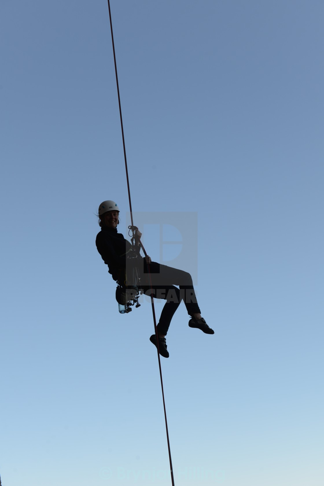 "absailing after climbing" stock image