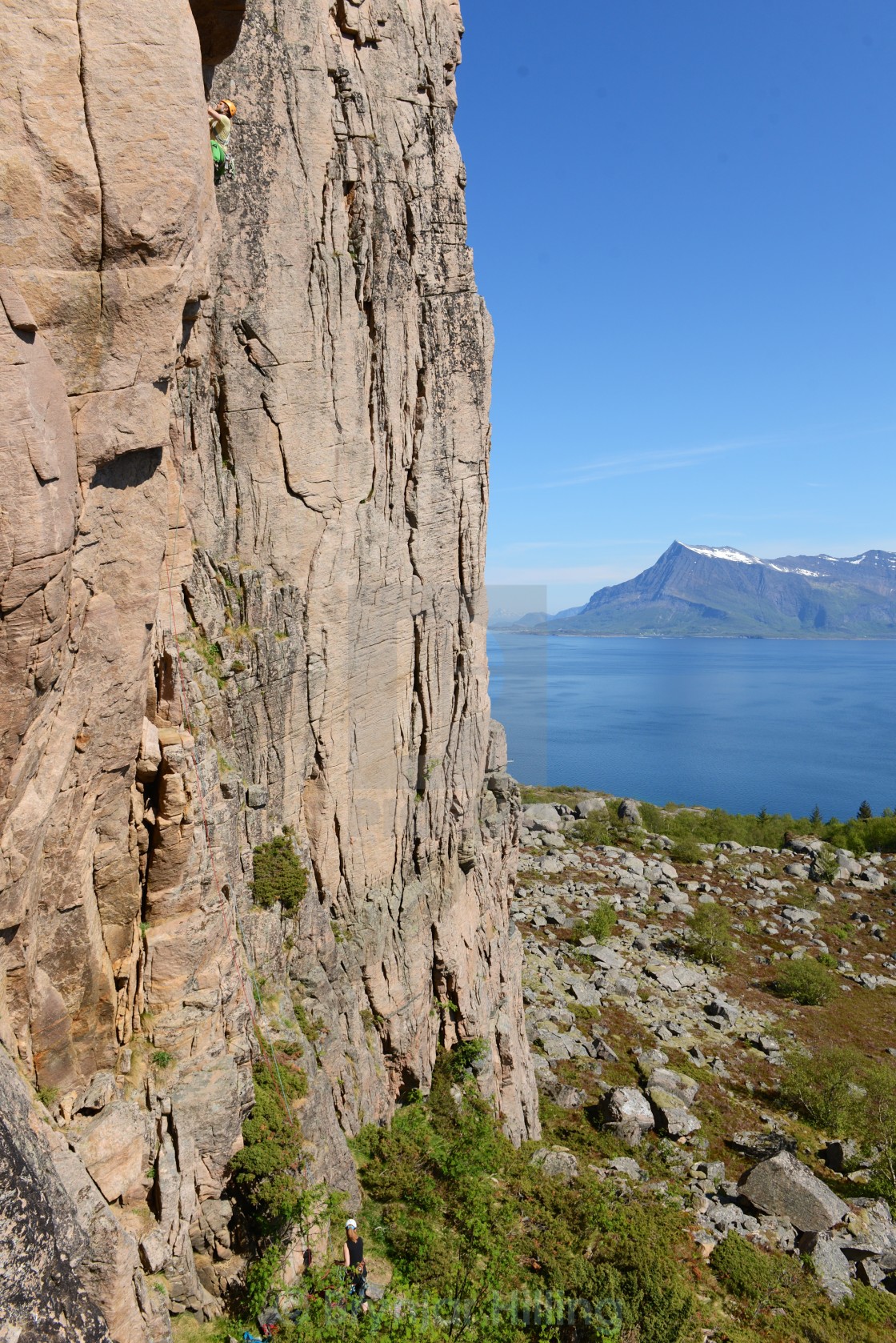 "Climbing up a steep rock" stock image