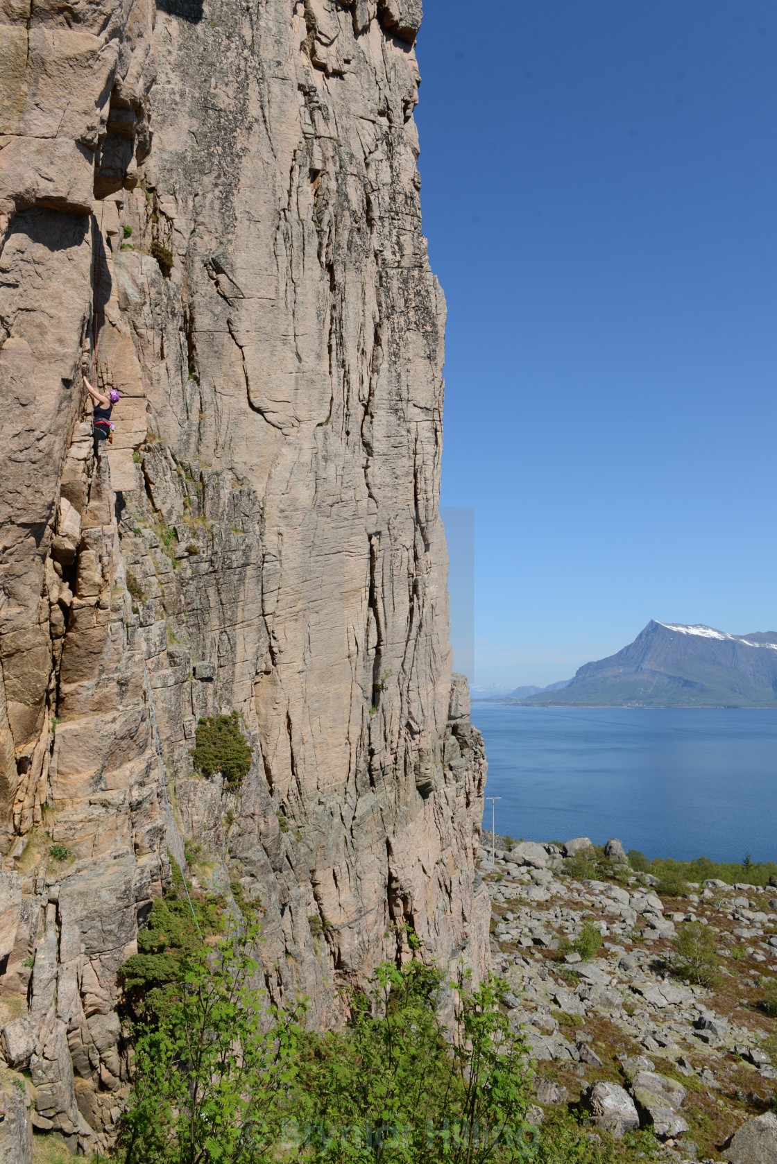 "Climbing up a steep rock" stock image