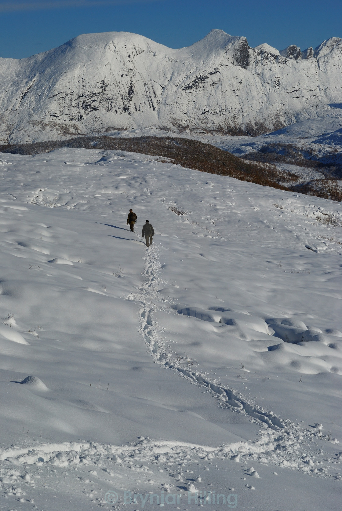 "Two elk hunters in snowy terrain" stock image
