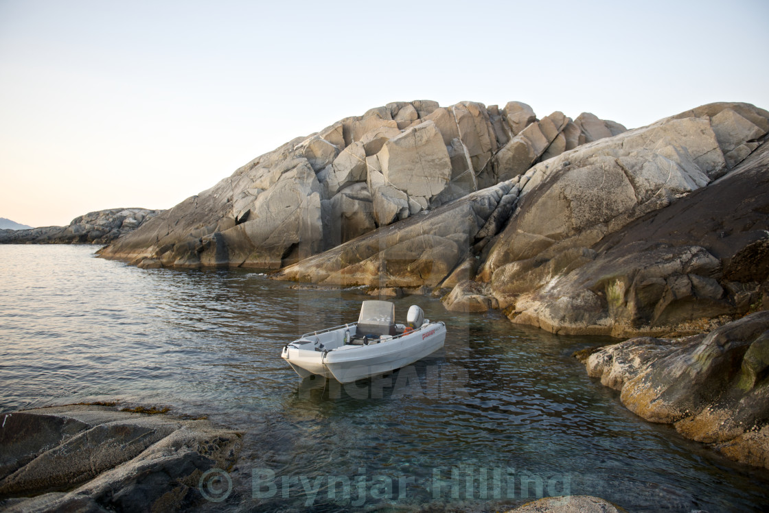 "Boat between rocks on an island" stock image