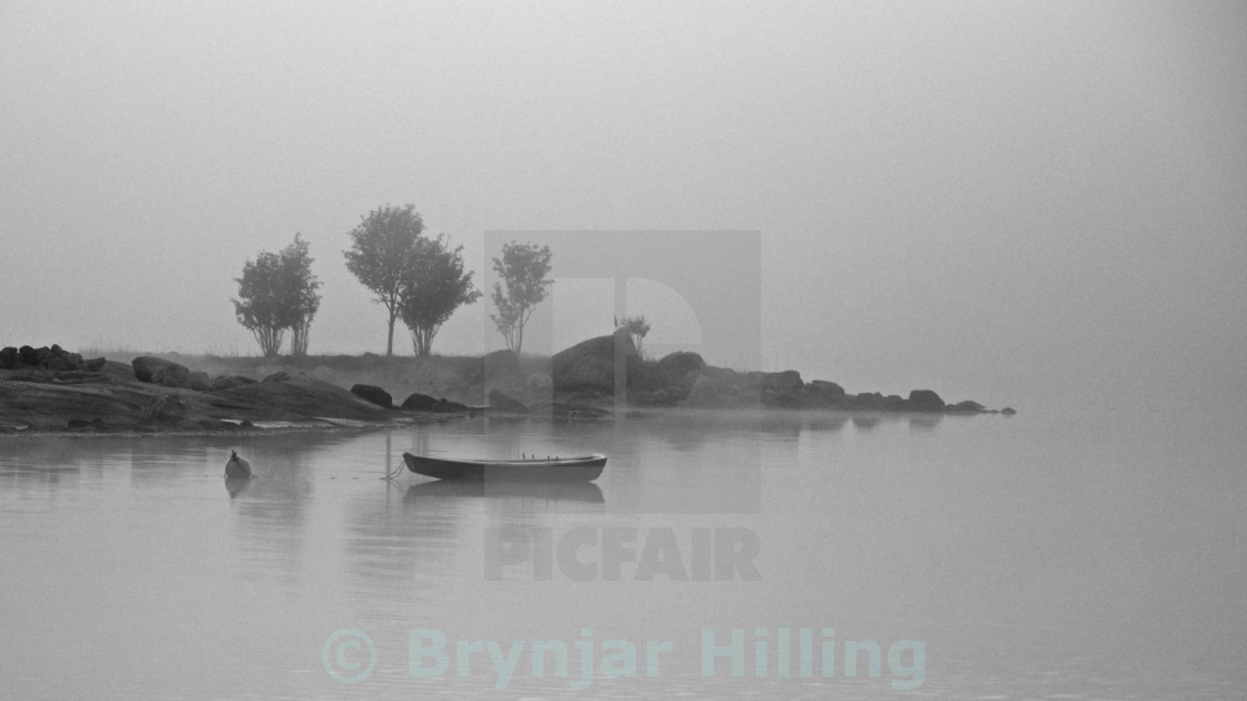 "Boat on water at night" stock image