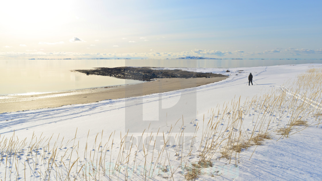 "Woman skiing beside the ocean" stock image