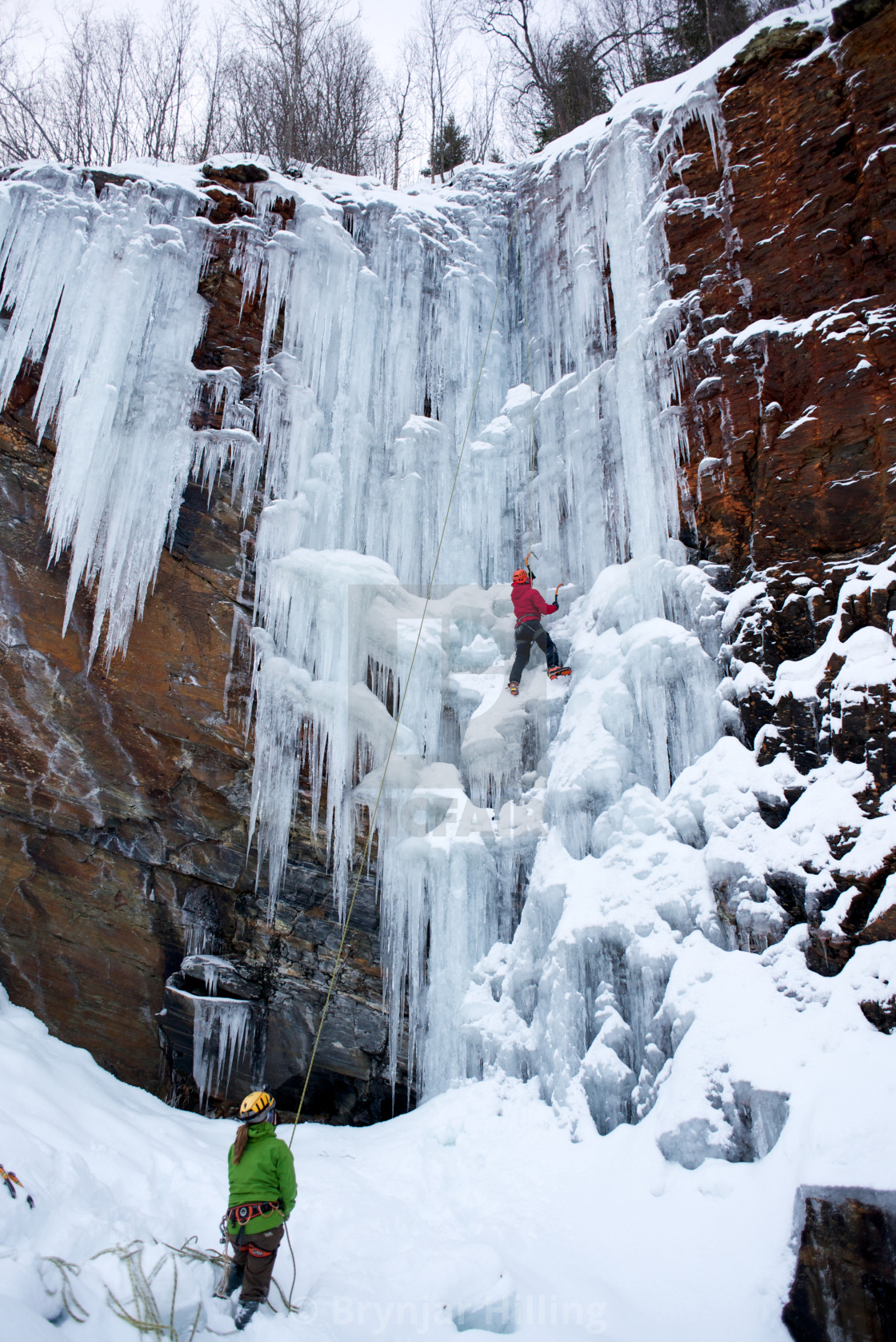 "Man climbing ice" stock image