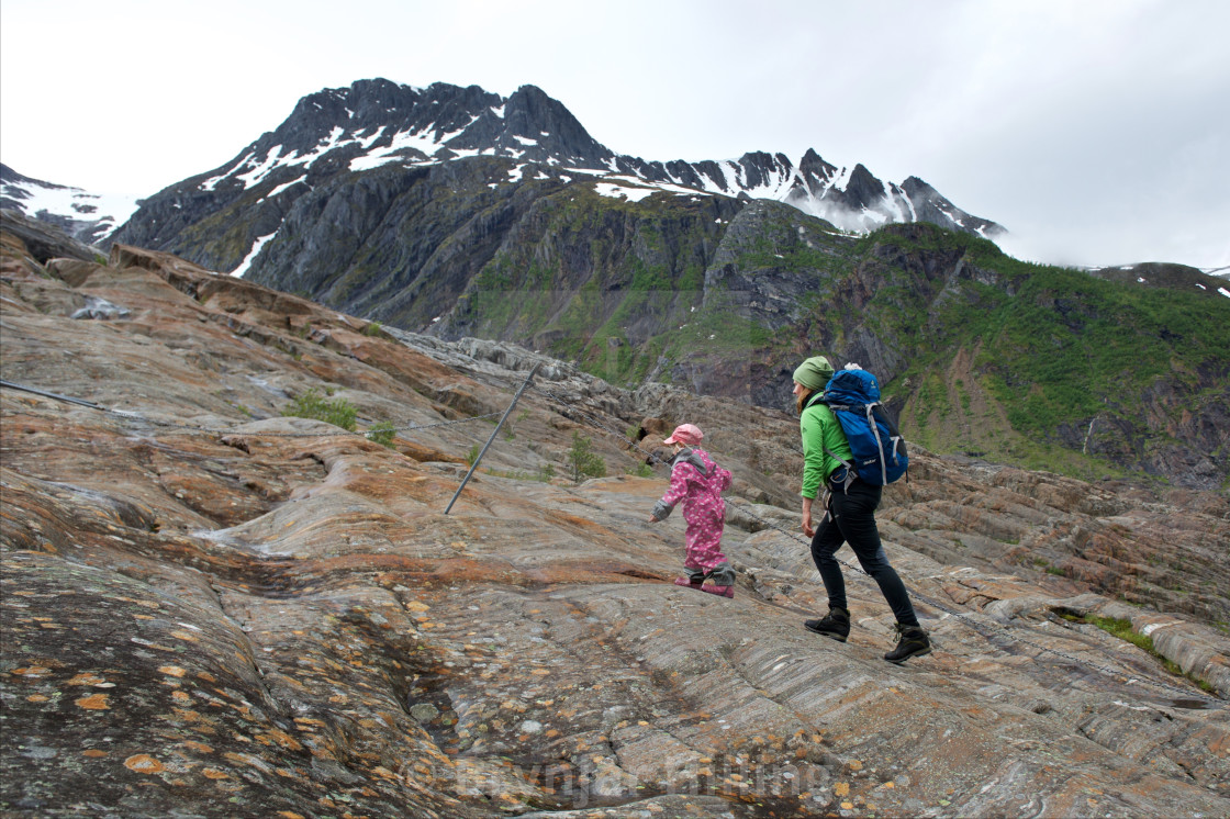 "Woman and girl going up the mountains" stock image