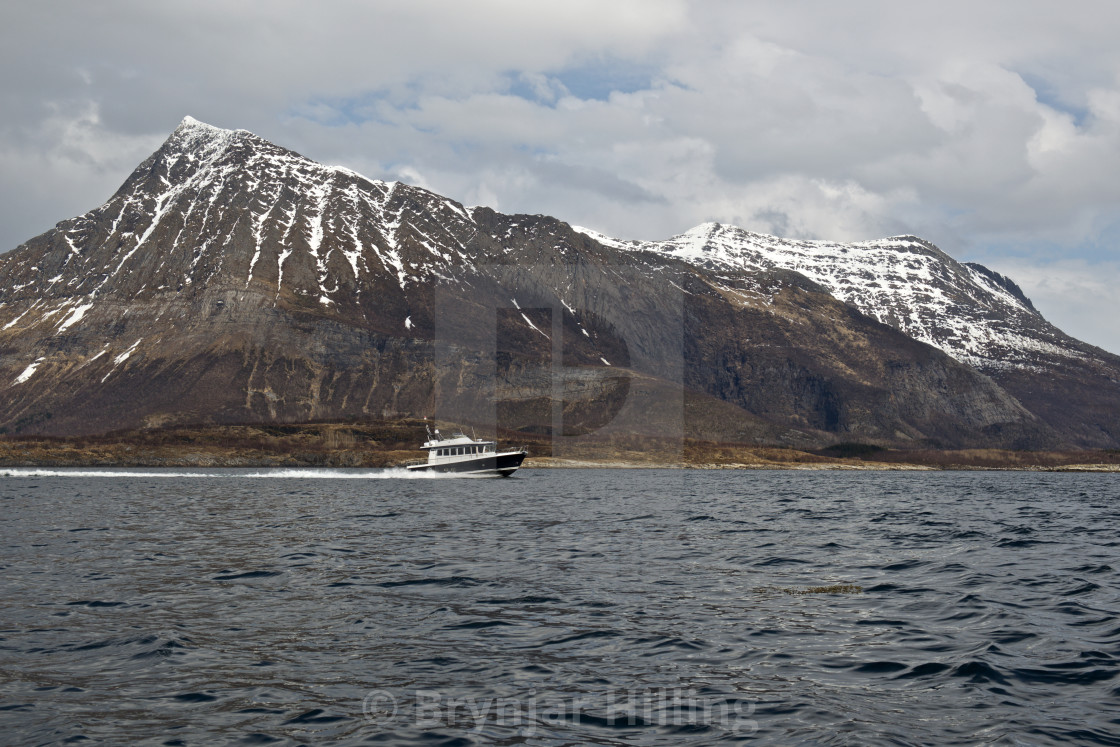 "Boat in front of mountain" stock image