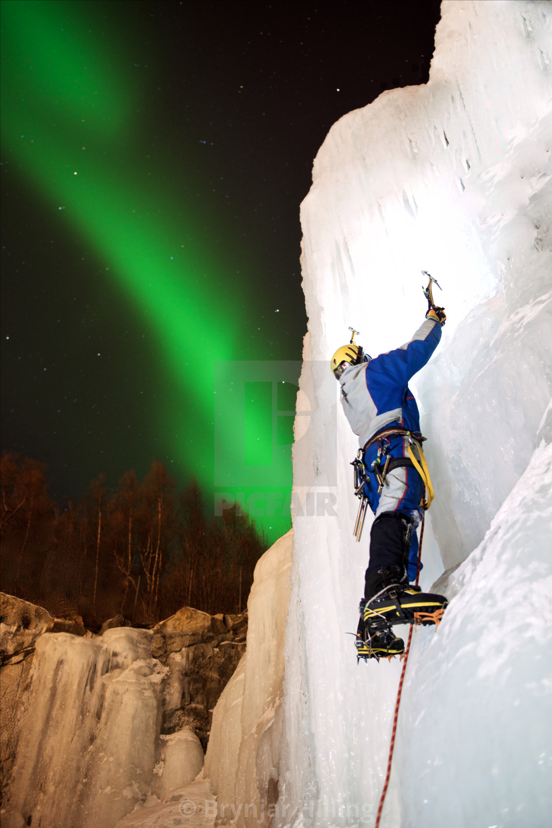 "Ice-climbing under Northern Lights" stock image