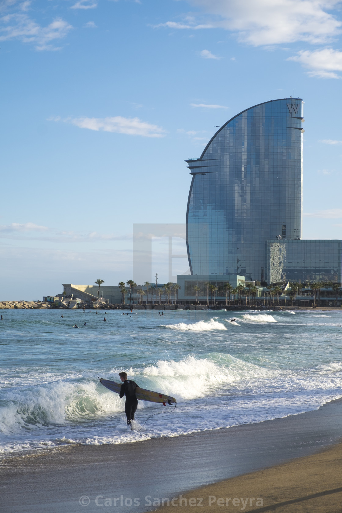 Surfing In The Popular Beach Of Barceloneta License