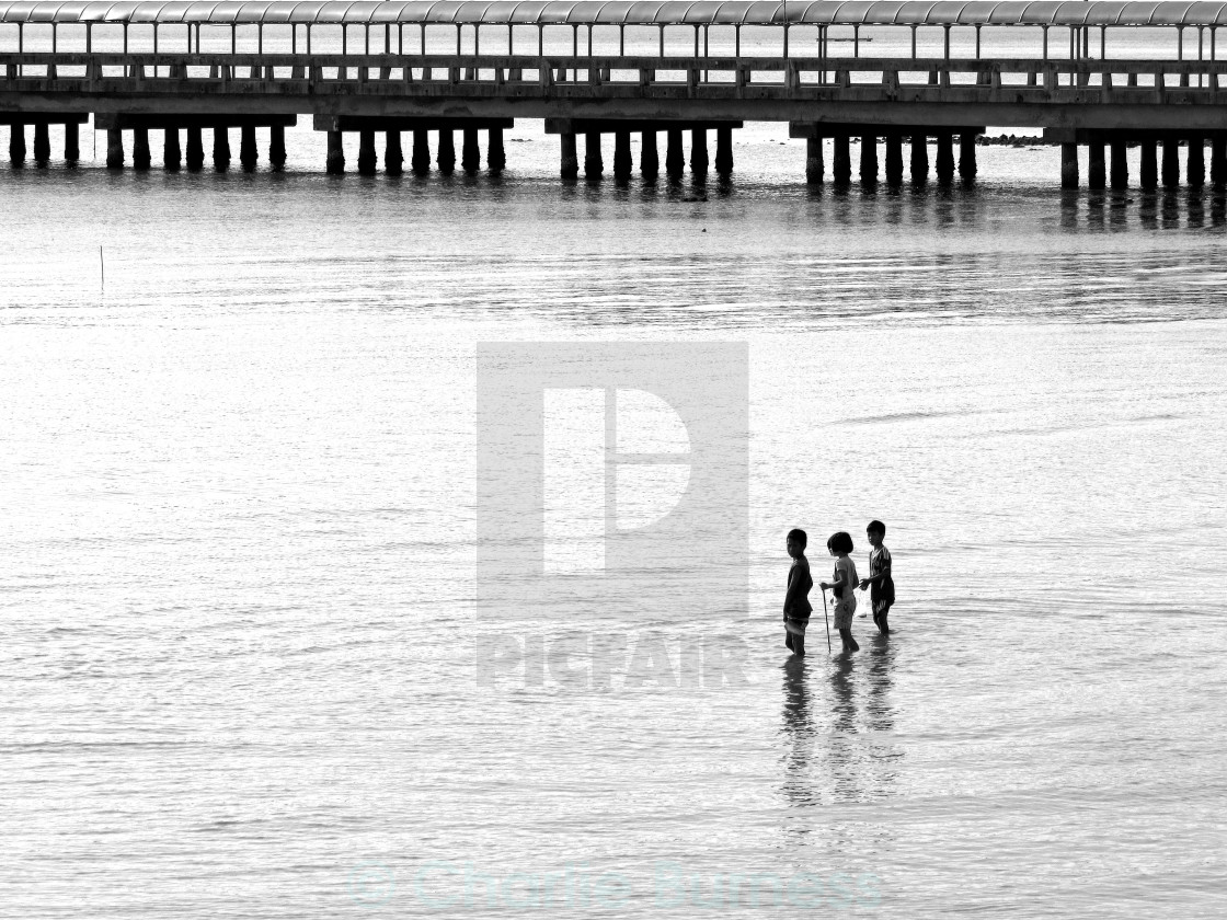 "Children Taking A Break From Spear Fishing" stock image