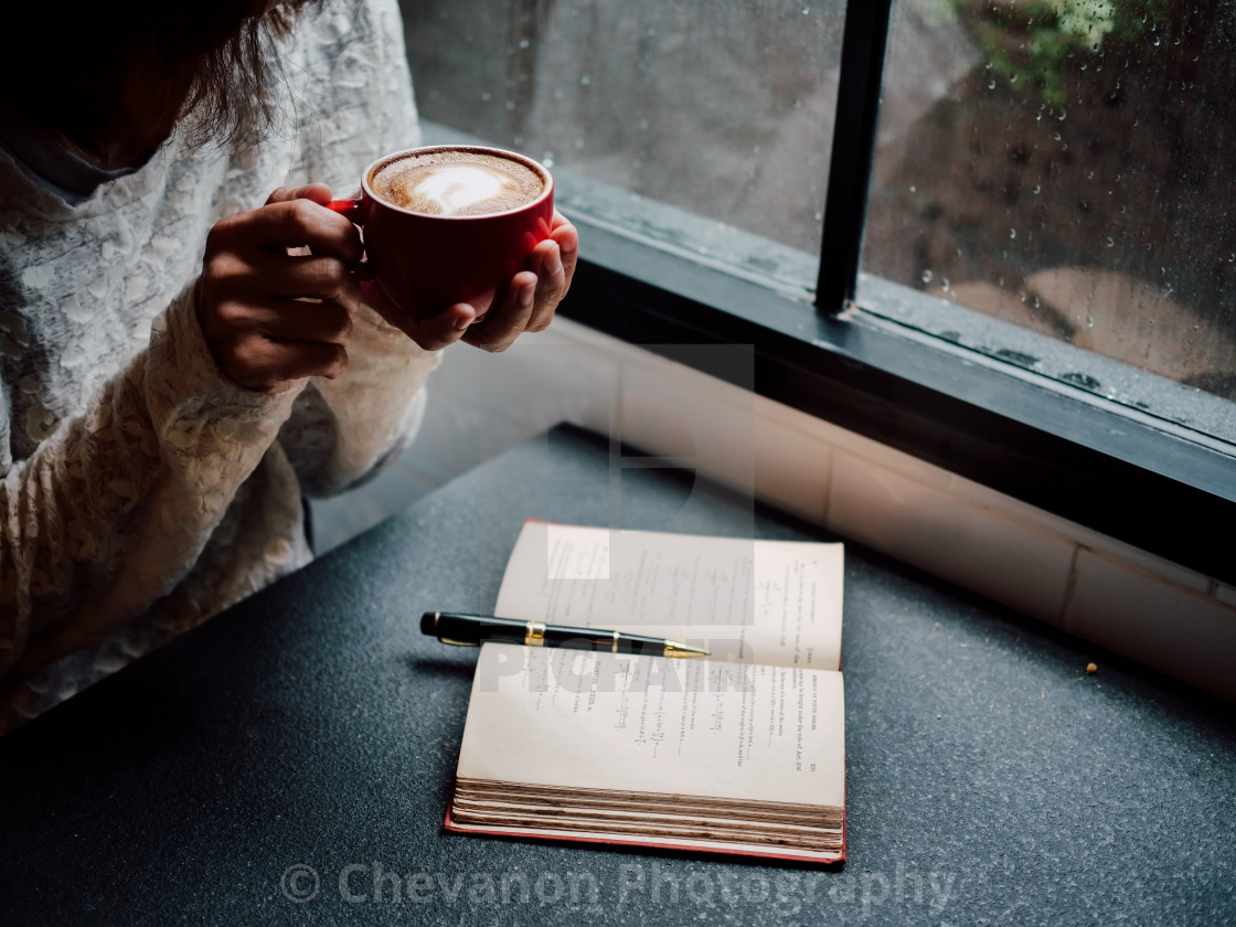 Woman Holding A Coffee Cup And Looking At The Window In Rainy Day License Download Or Print For 24 80 Photos Picfair
