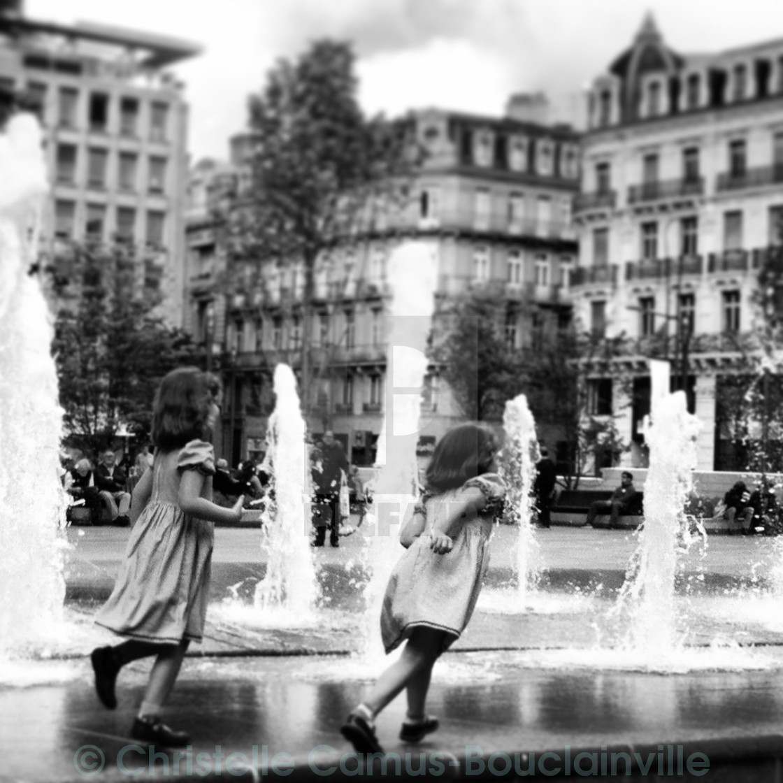 "two girls by the fountain" by Christelle Camus-Bouclainville - $7.67 "two girls by the fountain" stock image