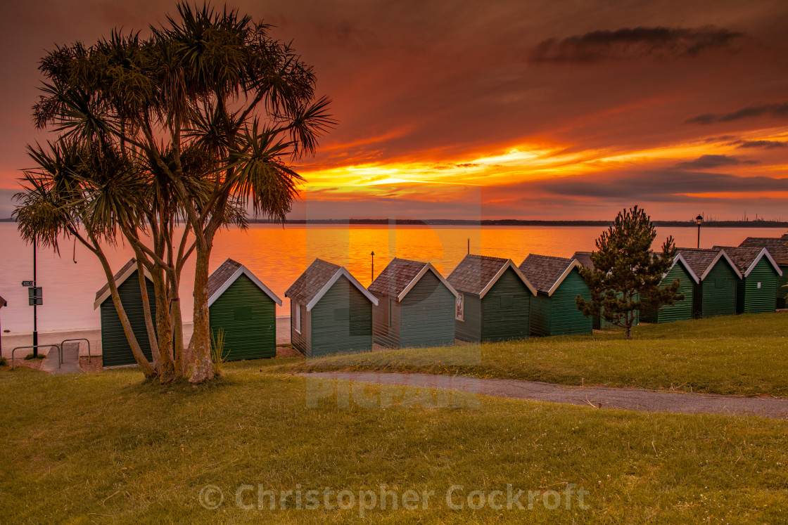 "Gurnard Beach Huts Sunset" stock image