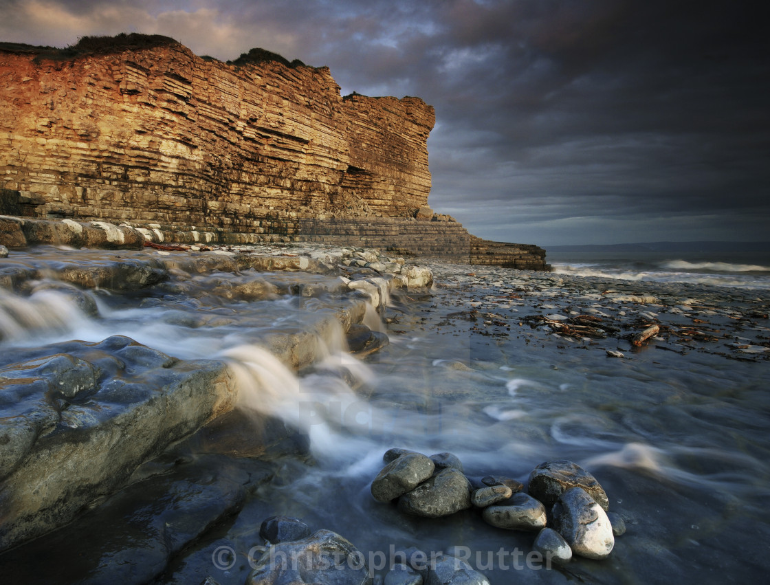 "A small waterfall flows into the sea near Monknash" stock image