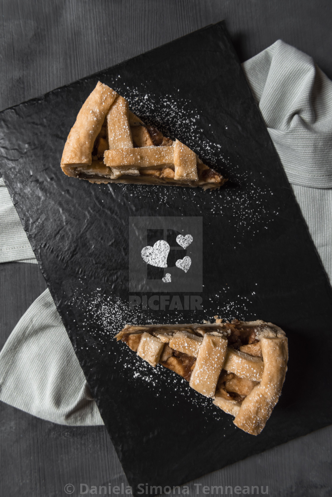 Apple Pie Slices On A Plate With Heart Shapes Decoration Above