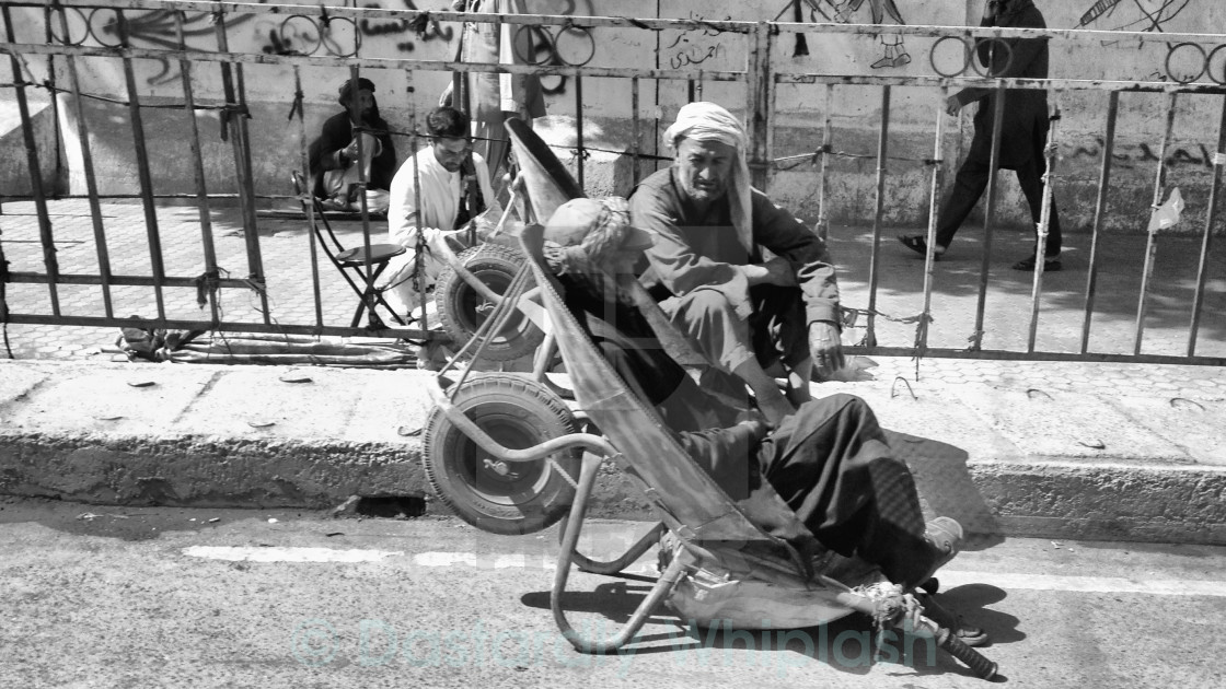 "Wheel Barrow Men" stock image