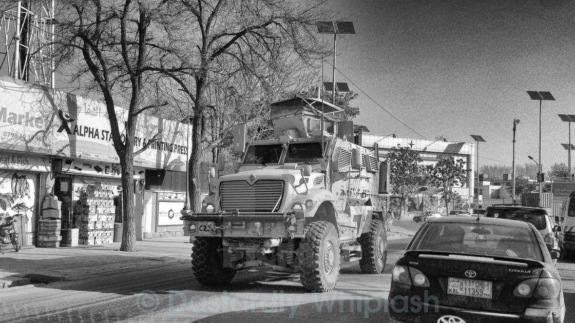 "ISAF MRAP mingling with traffic" stock image