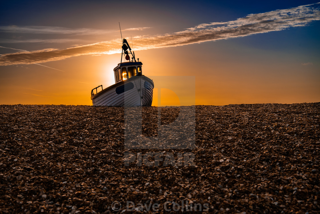 "Fishing Boat at Sunrise on Dungeness Beach" stock image