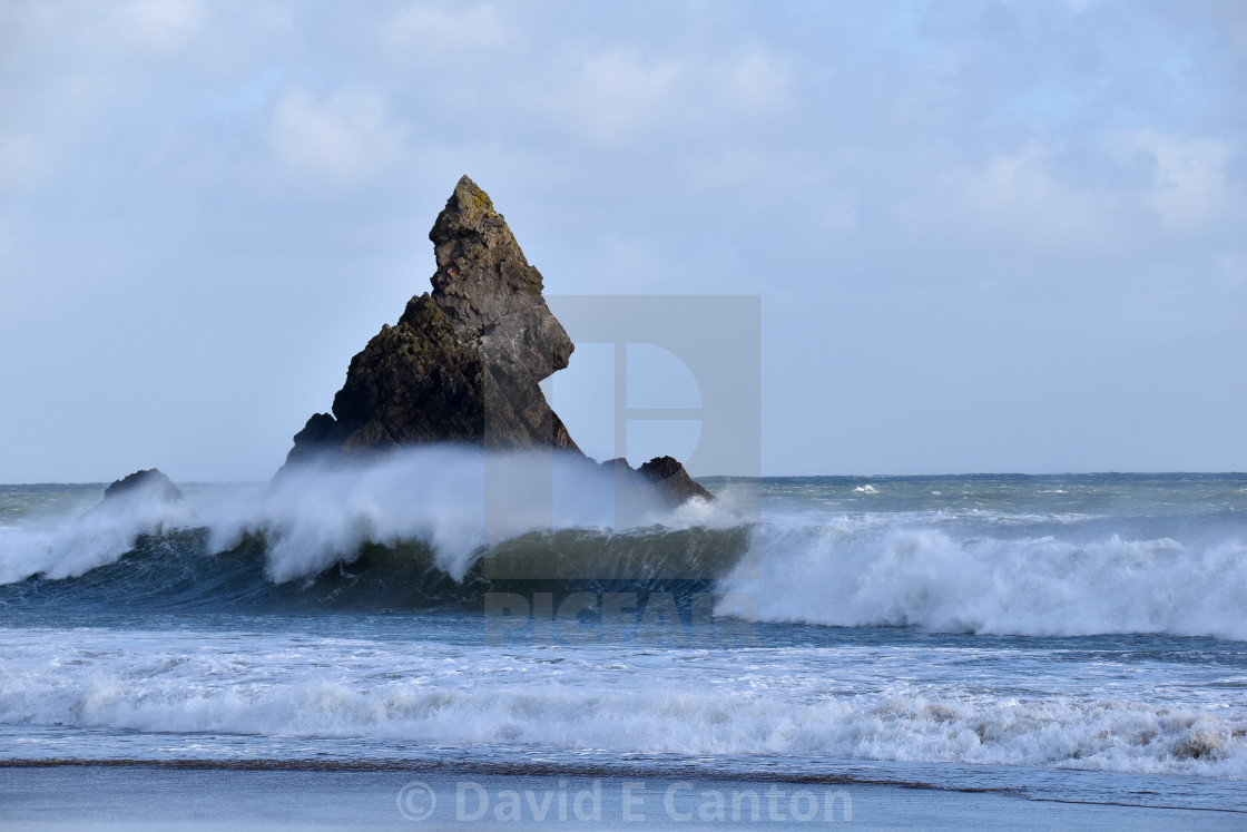 "Waves crashing near Church Rock in Pembrokeshire." stock image