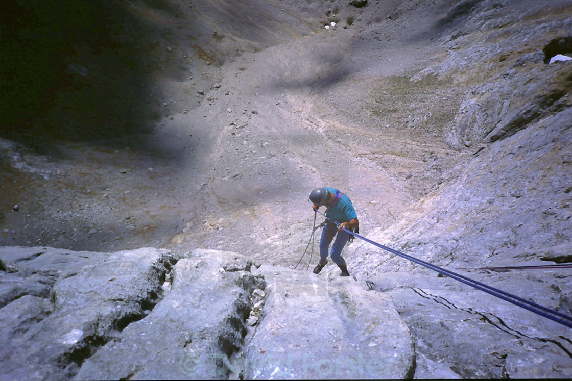 "Climber Abseiling off the Mountain of Naranjo de Bulnes (Picu Urriellu) Picos de Europa, Asturias, Spain EU" stock image