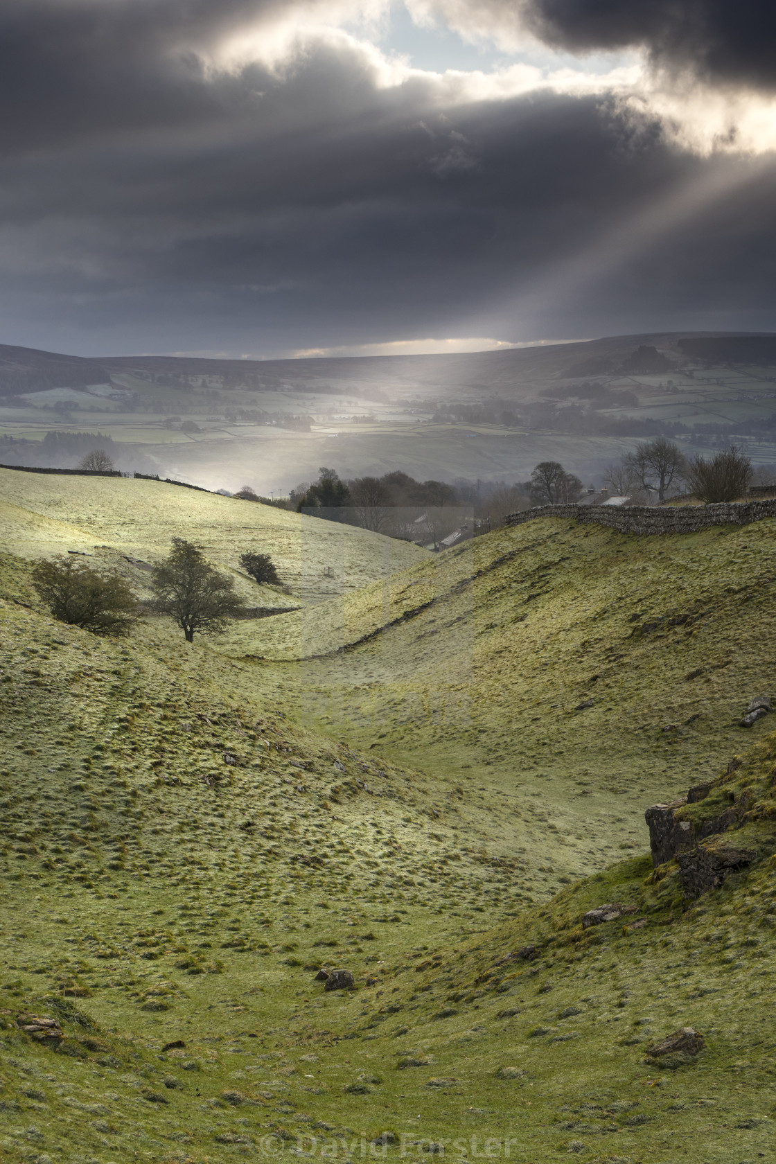 "Crepuscular Rays Illuminating a Frosty Tees Valley, North Pennines, County Durham, UK" stock image