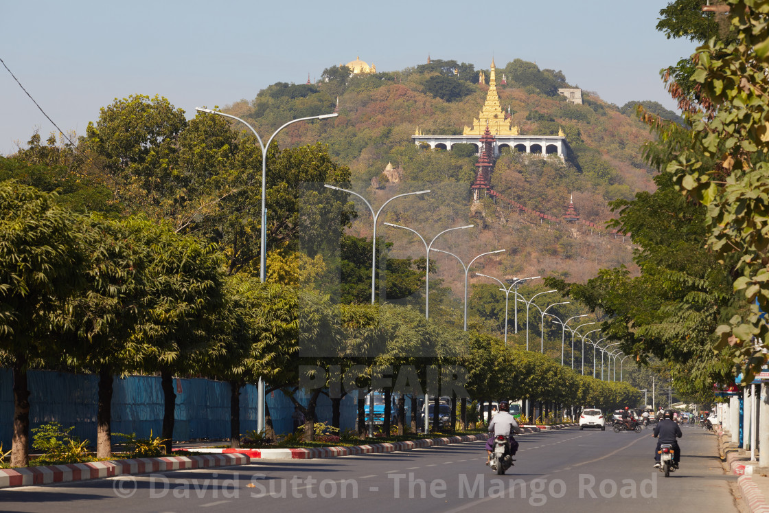 "Mandalay Hill, Mandalay, Myanmar. The Su Taung Pyae Pagoda can be seen at the..." stock image