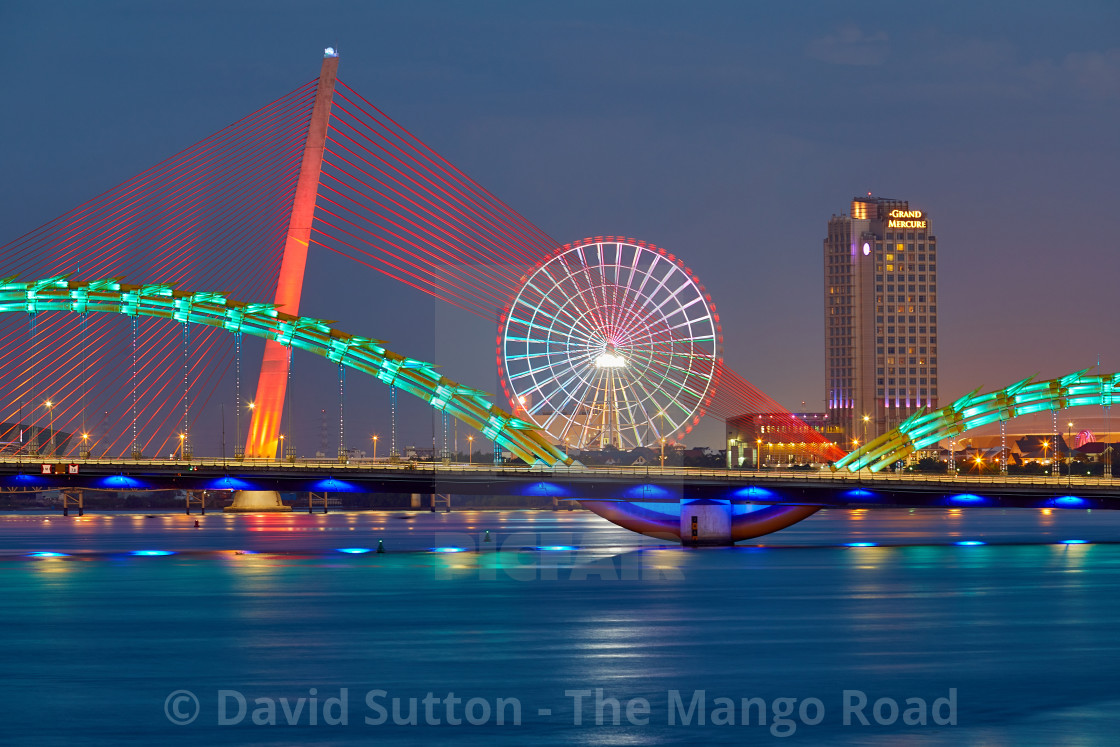 "View along the Han River with Dragon Bridge or Cầu Rồng (green) and Trần Thị..." stock image