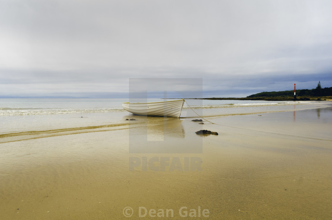 "Currarong on the NSW South Coast of Australia. There's a storm coming in. A beautiful wooden boats sits in the ebbing tide" by Dean Gale - $30.89 "Currarong on the NSW South Coast of Australia. There's a storm coming in. A beautiful wooden boats sits in the ebbing tide" stock image