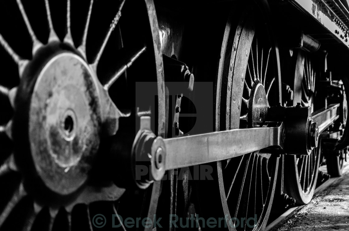 "Monochrome Close Up of Steam Engine Wheels" stock image