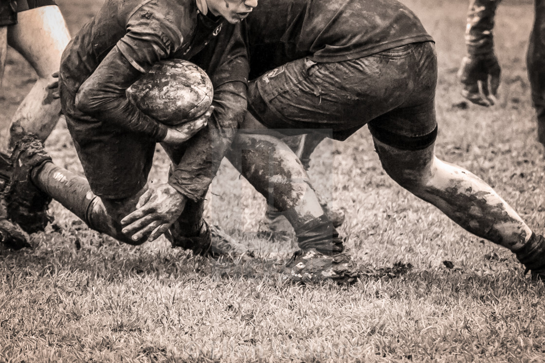 "Muddy Rugby Tackle" stock image