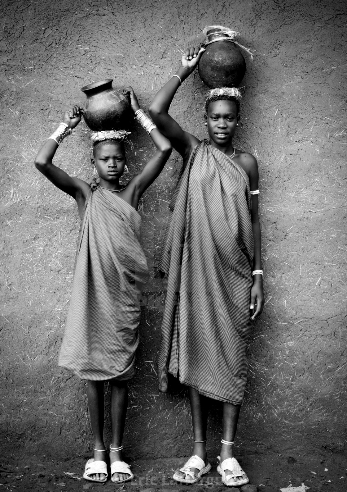 "Black And White Portrait Of Bodi Tribe Women Carrying Jars Of Milk On...