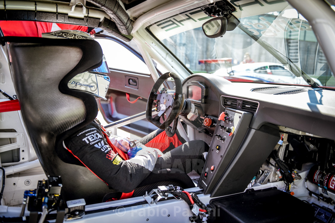Porsche Carrera racing car driver in cockpit , License